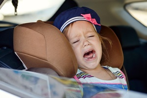 child crying in car